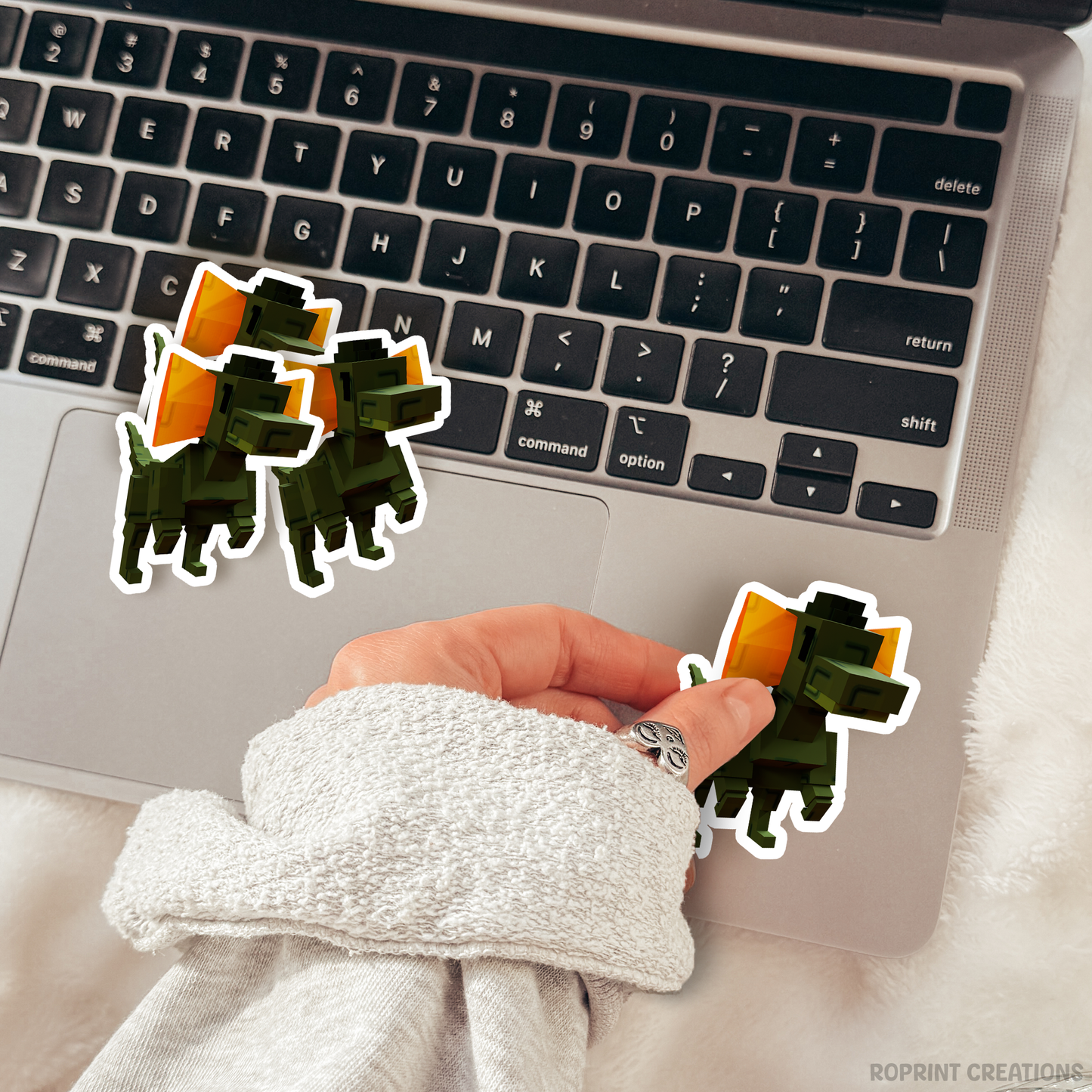 Brighten up your belongings with this adorable Grow A Garden Dilophosaurus sticker! Perfect for decorating notebooks, laptops, and party favors — the best gift for Roblox Grow A Garden fans.